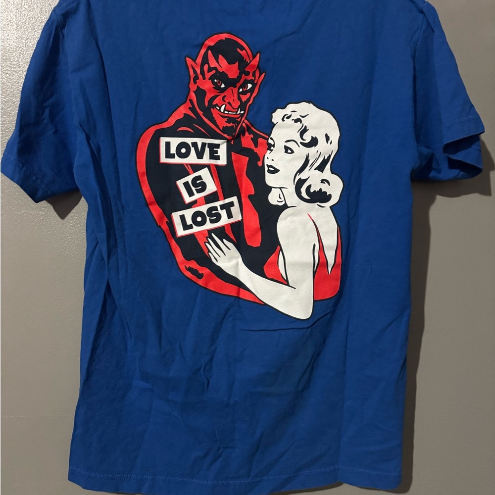 Blue Graphic Tee with Red and White Design